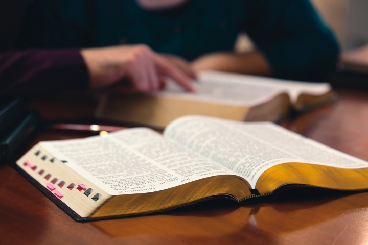 Open Bibles laying on a table.