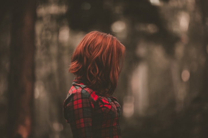 A woman with her head down.