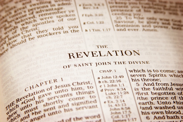 A Bible opened to the book of Revelation.