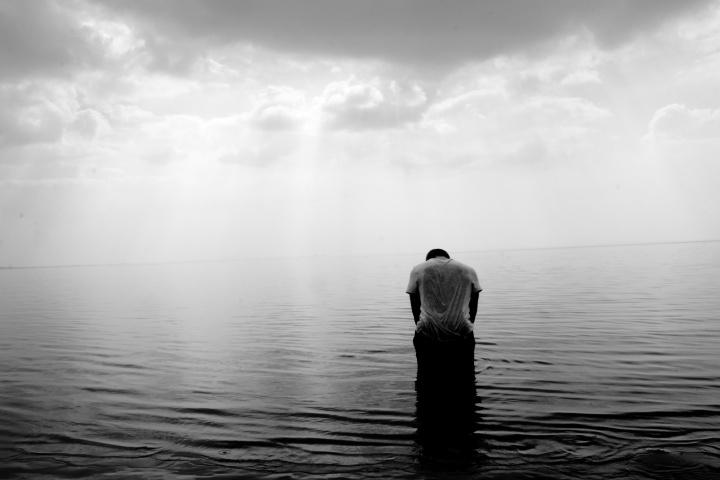 A man standing in water.