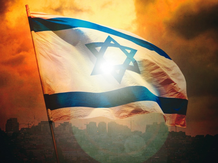 Israeli flag with Jerusalem in the background.