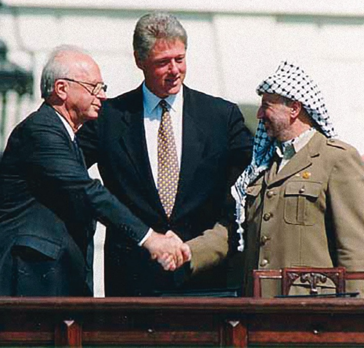Israeli Prime Minister Yitzhak Rabin, U.S. President Bill Clinton and Yasser Arafat at the Oslo I Accord signing in 1993.
