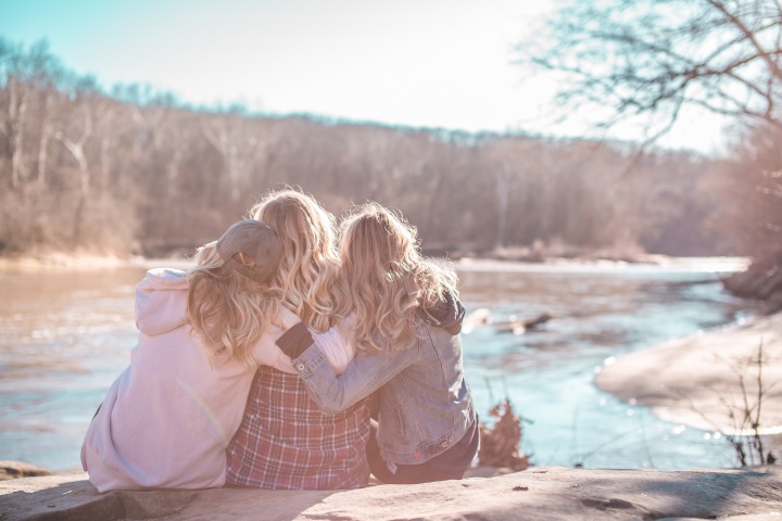 Friends hugging each other.