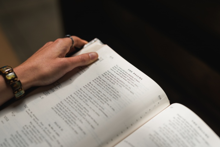 A woman reading a Bible.