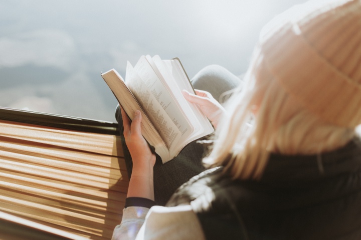 A woman reading a Bible.