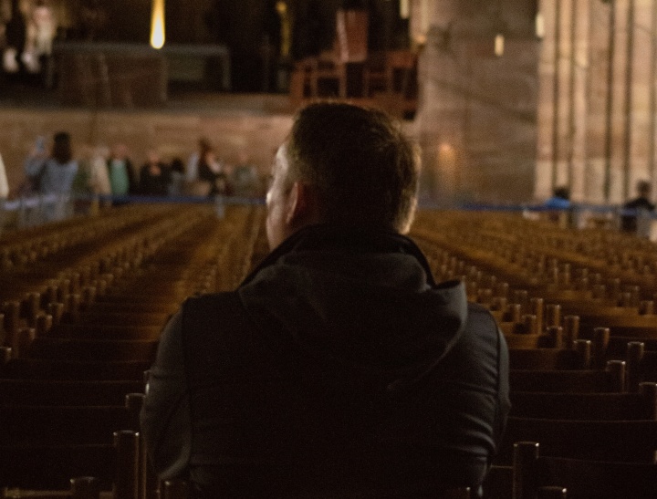 A man sitting in a church.