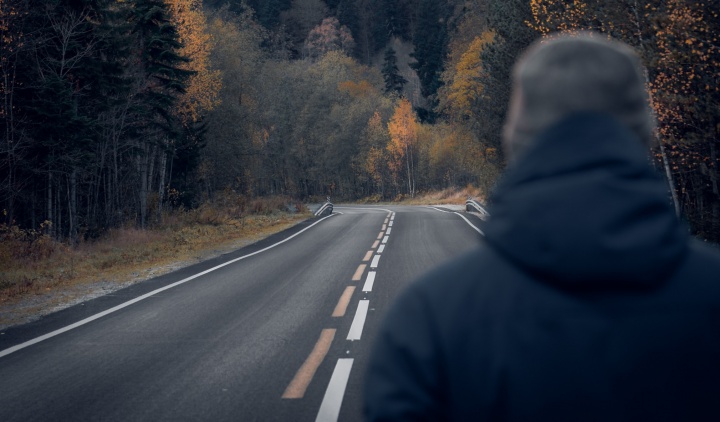 A man looking at a road.