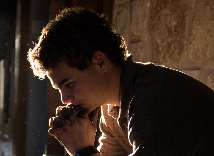 A young man meditating.