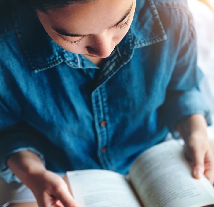 A woman reading a book.