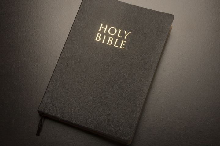 Bible laying on top of a table