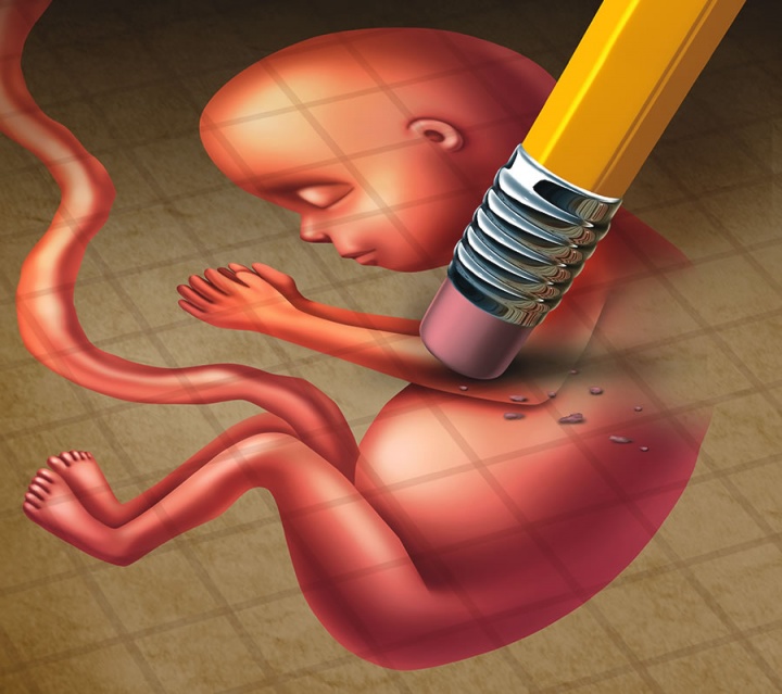 Erasing an illustration of a fetus.