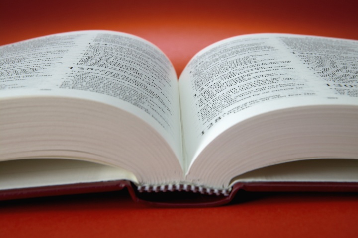 An open Bible laying on a table.