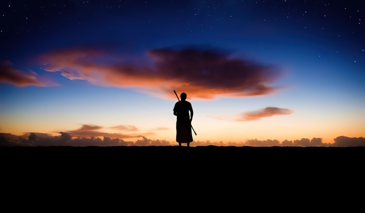 A person looking up into the night sky.