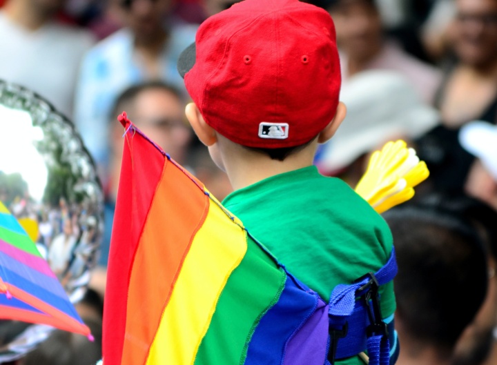 A young child at a pride parade.