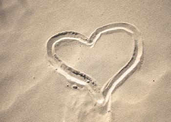 heart drawn in the sand