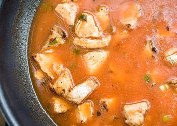 Chicken soup in a pot.