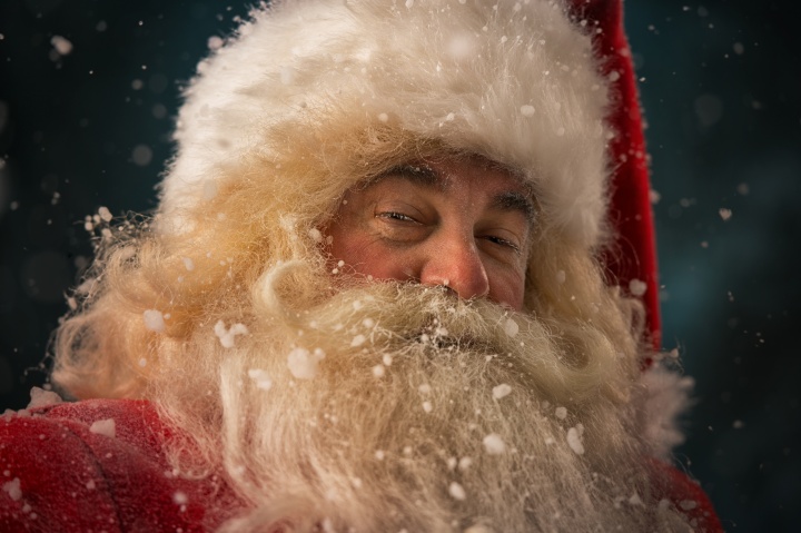 A person dressed up as Santa Claus
