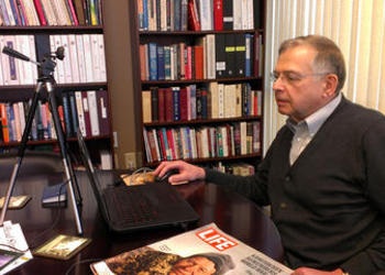 Victor Kubik talking with friends and family in Ukraine.