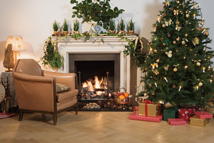 A Christmas tree in a festively decorated living room.