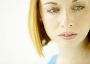 A young woman looking away.