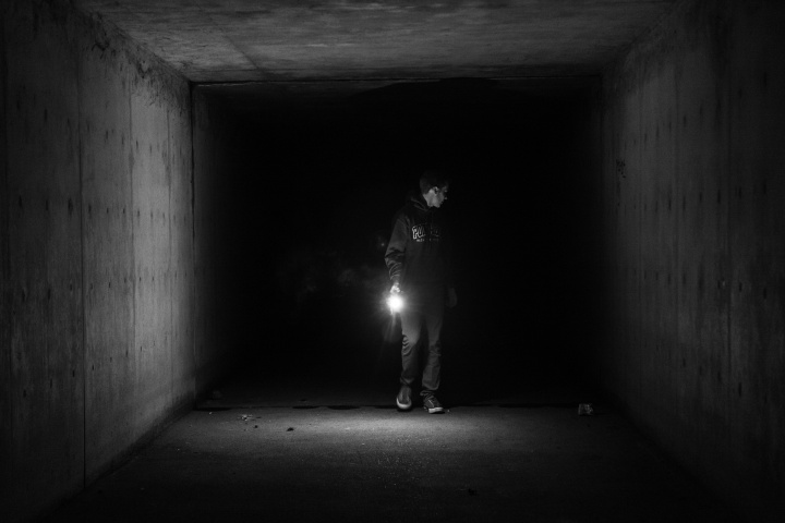 A person in a dark tunnel