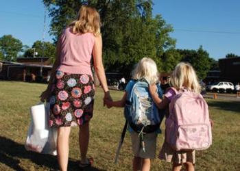 mom and daughters going to school