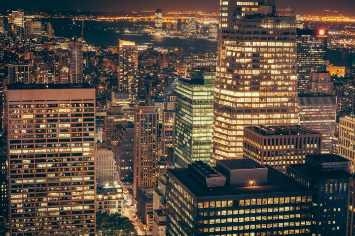 City buildings lit up a night.