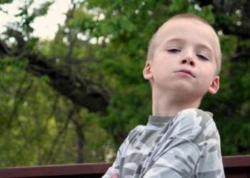 Young boy with head raised high and arms crossed - Respect: Is It a Dying Virtue