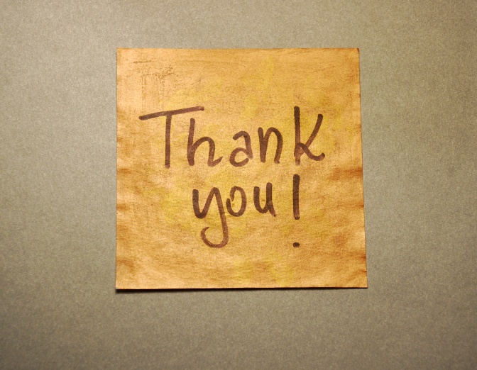 Thank you! written on brown paper.