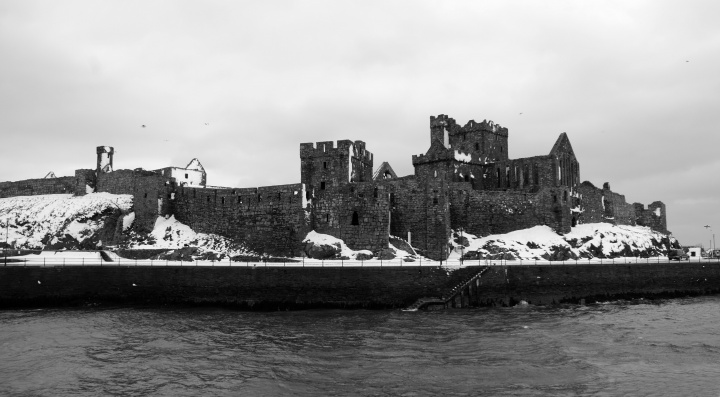 A old castle with broken fortress walls.