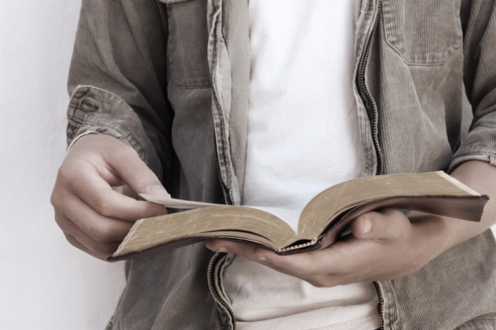 A man reading a Bible.