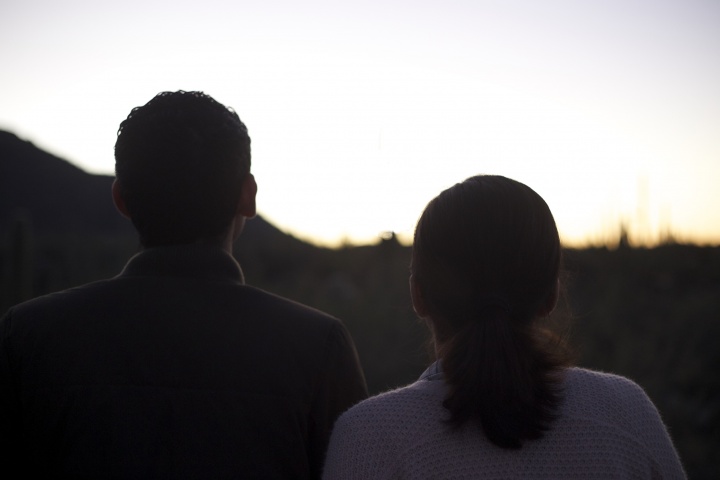 A young couple standing together.