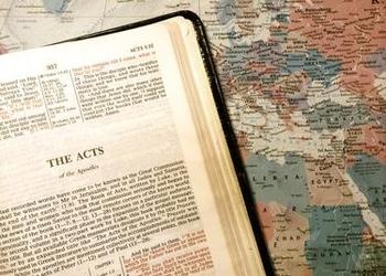 Bible opened to the book of Acts.