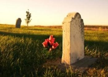 Grave with flowers at sunset - Understanding God's Word: The Resurrections of th