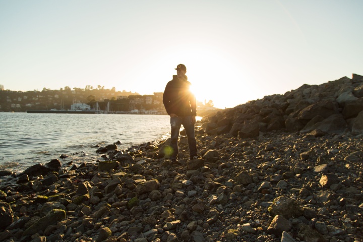 Sunset behind a person.