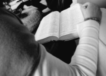 A young man reading his Bible.