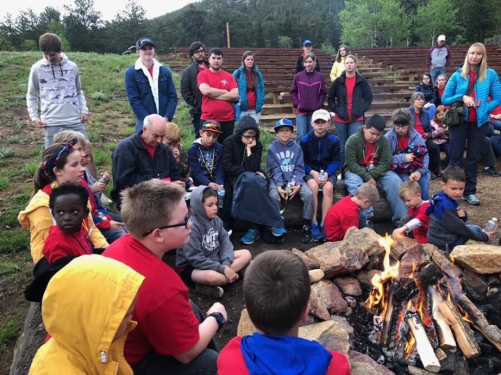 Campers and staff during bonfire time at camp Colorado.