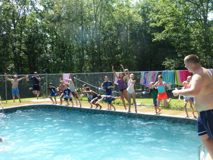 Campers cool off in the pool at camp Seven Mountains.
