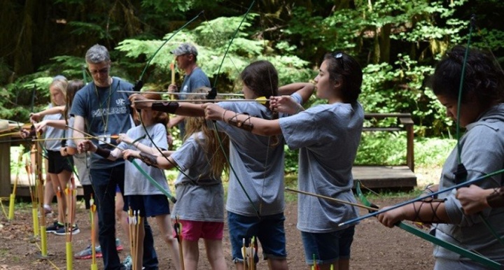 Campers do archery at Northwest preteen camp.