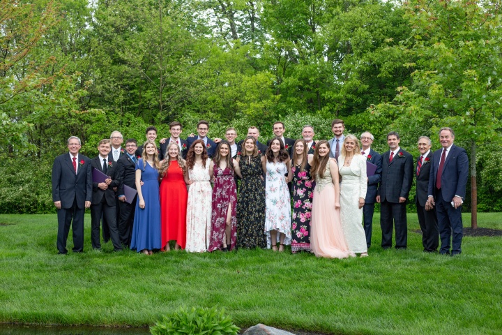 The ABC class of 2021 and faculty members smile after commencement