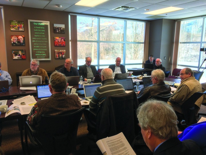 Members of the Council of Elders gather at the Home Office for their quarterly meeting. 