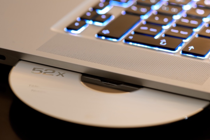 A laptop keyboard and CD