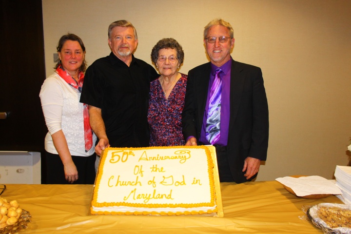 Members of the Maryland church show off the 50th Anniversary cake. 