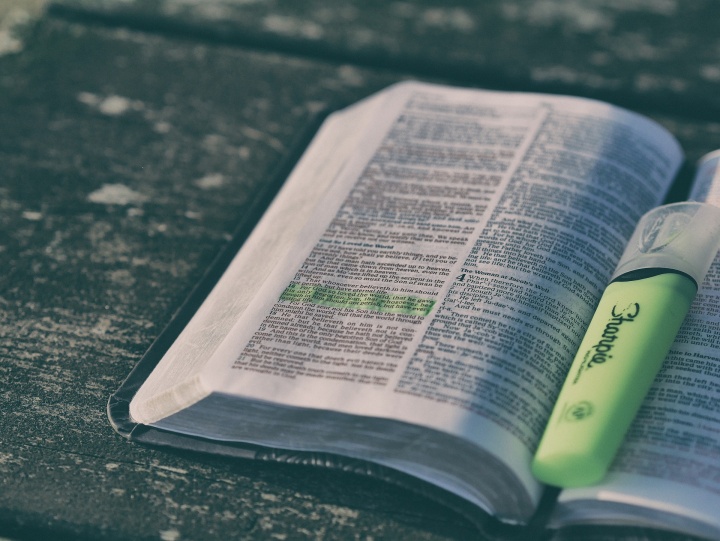 open Bible with a highlighter