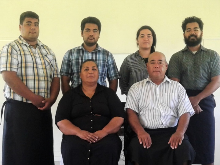 Frank Osika and his family at the Sabbath service hall on their property in Tonga.