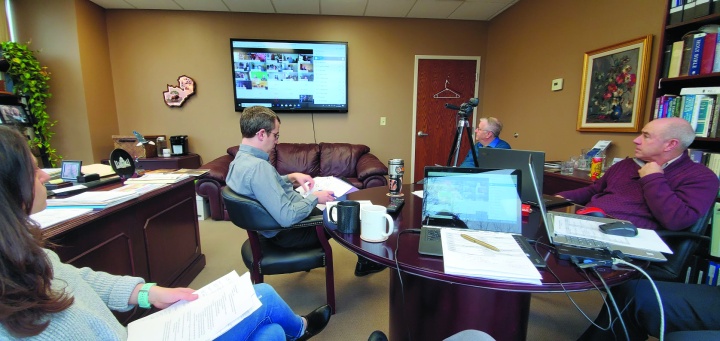 Ariana Del Signore, Dan Preston, Jorge de Campos, Mark Welch and Chris Rowland (right; not pictured) gather in  Victor Kubik's office for the festival planning meeting which was conducted with about 35 other people over WebEx.