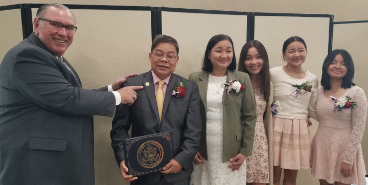 The Htoo family with late pastor Randy D’Alessandro.