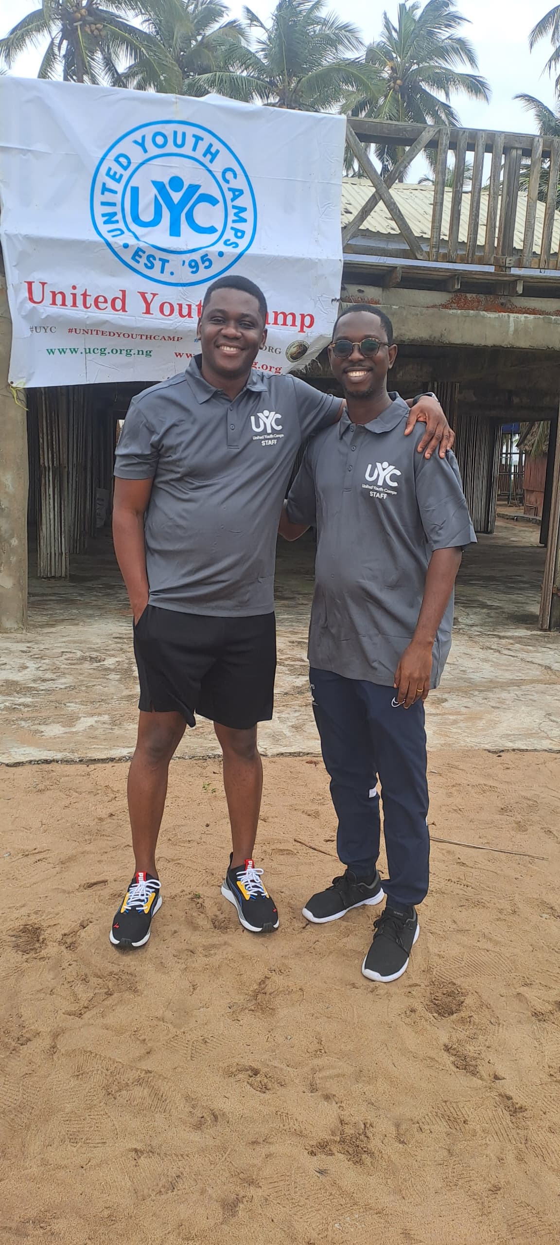 Adam and Franklin in front of the camp clubhouse