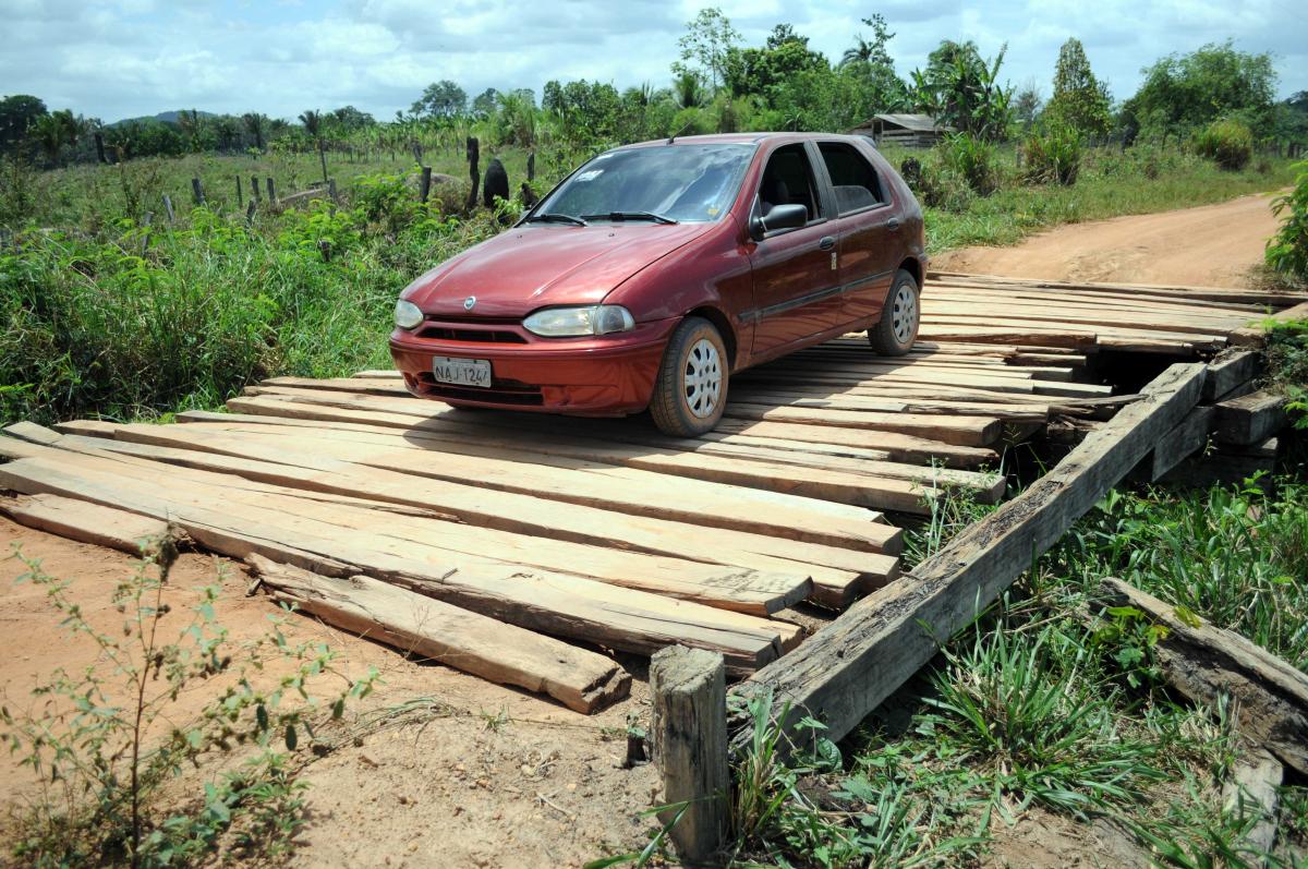 Rickety bridge that barely supports a car