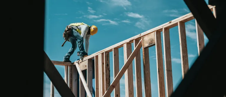 Man framing house